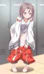  1girl alternate_hairstyle barefoot blurry brown_eyes commentary_request depth_of_field full_body gedoo_(gedo) hair_down hakama highres indoors japanese_clothes kantai_collection leaning_forward light_brown_hair locker locker_room long_hair looking_at_viewer puffy_pants red_hakama smile solo standing tile_floor tiles undressing wide_sleeves zuihou_(kantai_collection) 