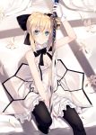  1girl arm_up artoria_pendragon_(all) bangs bare_shoulders between_legs black_bow black_legwear blonde_hair blush bow breasts caliburn cleavage closed_mouth comma dress eyebrows_visible_through_hair fate/unlimited_codes fate_(series) flower gloves green_eyes hair_between_eyes hair_bow hand_between_legs highres holding holding_sword holding_weapon knee_up medium_breasts nagishiro_mito saber_lily short_hair sitting smile solo strapless strapless_dress sword thighhighs weapon white_dress white_flower white_gloves 