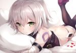  1girl ass bandaged_arm bandages bangs bare_shoulders bed_sheet black_footwear black_legwear black_panties black_shirt blurry blurry_background boots closed_mouth commentary_request depth_of_field eyebrows_visible_through_hair fate/grand_order fate_(series) green_eyes grey_hair hair_between_eyes jack_the_ripper_(fate/apocrypha) legs_up looking_at_viewer lowleg lowleg_panties lying nakatokung on_stomach panties petals pillow pillow_hug shirt shoulder_tattoo sleeveless sleeveless_shirt smile solo tattoo thigh_boots thighhighs underwear 