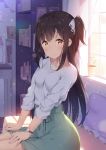  1girl :o bangs black_hair blurry blurry_background blush book bookshelf brown_eyes commentary_request curtains day depth_of_field desk_lamp eyebrows_visible_through_hair frilled_pillow frills green_skirt hair_between_eyes hair_ribbon hatsuki_kaname indoors lamp long_hair long_sleeves one_side_up original parted_lips pennant pillow ribbon shirt sitting skirt solo string_of_flags very_long_hair watch white_ribbon white_shirt window wristwatch 