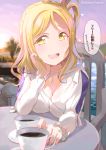  1girl birthday blonde_hair bracelet braid breasts chair cleavage commentary_request crown_braid cup hair_rings jewelry kitahara_tomoe_(kitahara_koubou) large_breasts long_sleeves looking_at_viewer love_live! love_live!_sunshine!! necklace ohara_mari solo table teacup translation_request twitter_username yellow_eyes 