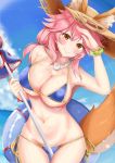  1girl absurdres animal_ear_fluff animal_ears beach beach_umbrella bikini blue_bikini blue_sky breasts cleavage collarbone commentary commentary_request day ears_through_headwear eyebrows_visible_through_hair fate/grand_order fate_(series) fox_ears fox_girl fox_tail groin hat highres innertube large_breasts looking_at_viewer navel ocean oni_no_shura outdoors pink_hair side-tie_bikini sky solo straw_hat sweat swimsuit tail tamamo_(fate)_(all) tamamo_no_mae_(swimsuit_lancer)_(fate) umbrella yellow_eyes 