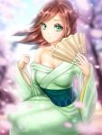  1girl bangs blurry blurry_background blurry_foreground breasts brown_hair cherry_blossoms cleavage closed_mouth collarbone commentary_request day eyebrows_visible_through_hair fan floating_hair gigamessy green_eyes green_kimono holding holding_fan japanese_clothes kimono long_hair medium_breasts obi off_shoulder original outdoors sash shiny shiny_hair sitting smile solo swept_bangs yukata 