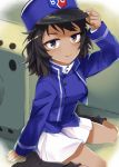  1girl andou_(girls_und_panzer) bangs bc_freedom_(emblem) bc_freedom_military_uniform black_hair blue_headwear blue_jacket blue_vest boots brown_eyes dark_skin emblem eyebrows_visible_through_hair girls_und_panzer ground_vehicle hand_on_headwear hat high_collar jacket kusano_houki long_sleeves looking_at_viewer medium_hair messy_hair military military_vehicle motor_vehicle pleated_skirt shako_cap sitting skirt smile solo tank thighs vest white_skirt 