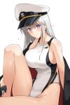  1girl azur_lane black_gloves blue_eyes blush breasts cape closed_mouth collarbone competition_swimsuit enterprise_(azur_lane) fingerless_gloves gloves half_gloves harukon_(halcon) hat knee_up large_breasts looking_at_viewer one-piece_swimsuit peaked_cap sideboob sidelocks silver_hair simple_background sitting solo swimsuit white_background white_cap white_swimsuit 