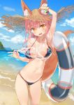  1girl animal_ear_fluff animal_ears arm_up armpits bangs banned_artist beach bikini bikini_under_clothes blue_bikini blue_sky blush bracelet breasts cleavage cloud cloudy_sky collarbone commentary_request day ears_through_headwear eyebrows_visible_through_hair fang fate/grand_order fate_(series) fox_ears fox_girl fox_tail hat highres innertube jewelry looking_at_viewer navel ocean open_mouth outdoors pink_hair sabet_(young_ouo) sand see-through shirt sky smile solo standing straw_hat sun_hat swimsuit tail tamamo_(fate)_(all) tamamo_no_mae_(fate) tamamo_no_mae_(swimsuit_lancer)_(fate) water wet wet_clothes wet_shirt wet_t-shirt yellow_eyes 