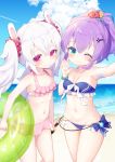  2girls ;) azur_lane bangs bare_shoulders beach bikini blue_bikini blue_flower blue_sky blush bottle breasts closed_mouth cloud collarbone commentary_request day eyebrows_visible_through_hair flower green_eyes groin hair_between_eyes hair_flower hair_ornament hand_up high_ponytail highres holding holding_bottle holding_innertube horizon innertube javelin_(azur_lane) javelin_(beach_picnic!)_(azur_lane) koko_ne_(user_fpm6842) laffey_(azur_lane) long_hair multiple_girls navel ocean one_eye_closed outdoors pink_bikini ponytail purple_hair reaching_out red_flower sand self_shot silver_hair sky small_breasts smile swimsuit transparent twintails very_long_hair water yellow_flower 