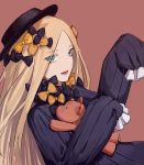  1girl :d abigail_williams_(fate/grand_order) arm_up bangs black_bow black_dress black_headwear blonde_hair blue_eyes bow brown_background commentary_request dress eyebrows_visible_through_hair eyes_visible_through_hair fate/grand_order fate_(series) forehead hair_bow hat highres long_hair long_sleeves looking_at_viewer object_hug open_mouth orange_bow parted_bangs polka_dot polka_dot_bow simple_background sleeves_past_fingers sleeves_past_wrists smile solo stuffed_animal stuffed_toy teddy_bear upper_body veolia 