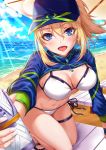  1girl :d ahoge arm_support artoria_pendragon_(all) bangs baseball_cap beach beach_chair beach_umbrella bikini blonde_hair blue_eyes blue_headwear blue_jacket blue_sky blush breasts cleavage cloud commentary_request cropped_jacket day eyebrows_visible_through_hair fate/grand_order fate_(series) hair_between_eyes hair_through_headwear hat head_tilt highres holding jacket kneeling leaning_forward light_rays long_hair long_sleeves looking_at_viewer medium_breasts mysterious_heroine_xx_(foreigner) navel ocean open_mouth outdoors outstretched_arm ponytail sakiyamama sandals short_hair shrug_(clothing) side-tie_bikini sidelocks sky smile solo sparkle stomach sunlight swimsuit thigh_strap thighs umbrella water white_bikini wristband zipper_pull_tab 