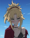  1girl bare_shoulders black_bra black_choker blonde_hair blush bra braid choker day eyebrows_visible_through_hair fang fate/grand_order fate_(series) frown green_eyes highres jacket long_hair looking_at_viewer mordred_(fate)_(all) mordred_(swimsuit_rider)_(fate) outdoors ponytail red_jacket red_scrunchie scrunchie solo tonee underwear 