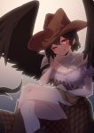  1girl absurdres bandana bangs bare_shoulders beige_background black_hair black_wings blue_background blue_shirt blush breasts brown_headwear brown_skirt cleavage cowboy_hat crossed_legs feathered_wings feet_out_of_frame frills gradient gradient_background grin hair_between_eyes hand_up hat highres kurokoma_saki looking_at_viewer medium_breasts off-shoulder_shirt off_shoulder one_eye_closed plaid plaid_skirt puffy_short_sleeves puffy_sleeves red_eyes shirt short_hair short_sleeves sitting skirt smile solo thighs touhou tuck wings 