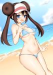  1girl beach bikini blue_bikini blush breasts brown_hair commentary_request day double_bun eyebrows_visible_through_hair hair_between_eyes long_hair looking_at_viewer medium_breasts mei_(pokemon) navel open_mouth outdoors pokemon solo swimsuit toshishikisai twintails visor_cap water 