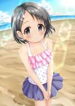  1girl bangs bare_arms bare_shoulders beach black_eyes black_hair blue_skirt blue_sky blush bunny_hair_ornament camisole closed_mouth cloud cloudy_sky collarbone day eyebrows_visible_through_hair hair_ornament hairclip highres horizon idolmaster idolmaster_cinderella_girls ocean outdoors pleated_skirt polka_dot polka_dot_camisole regular_mow sand sasaki_chie skirt sky solo standing water white_camisole 