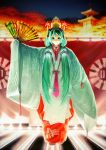  1girl bangs blue_eyes blurry blurry_background character_mask closed_mouth commentary_request depth_of_field eyebrows_behind_hair facing_viewer fan folding_fan glowing green_hair green_kimono hair_between_eyes hair_ornament hatsune_miku headpiece headset highres holding holding_fan japanese_clothes kimono long_hair long_sleeves night night_sky outdoors pagoda print_kimono red_kimono sky sleeves_past_fingers sleeves_past_wrists smile socks solo stage standing tabi twintails v-shaped_eyebrows very_long_hair vocaloid white_legwear wide_sleeves yoka1chi 