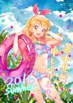  1girl 2016 :d aikatsu! aikatsu!_(series) bikini blonde_hair blush bow breasts cloud cloudy_sky commentary_request cowboy_shot day floating_hair frilled_bikini frills hair_bow hairband hand_behind_head holding holding_innertube hoshimiya_ichigo innertube katou_akatsuki long_hair navel open_mouth plant red_eyes round_teeth side-tie_bikini sky small_breasts smile solo summer swimsuit teeth upper_teeth 