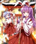  2girls alternate_costume animal_ears arm_up blue_hair blurry blurry_background blush bow breasts broom brown_footwear commentary_request detached_sleeves hair_between_eyes hand_up hands_up highres holding holding_broom japanese_clothes lantern long_hair long_sleeves looking_at_viewer looking_to_the_side medium_breasts multiple_girls open_mouth paper_lantern pink_eyes purple_hair rabbit_ears rabbit_girl red_bow red_eyes red_shirt red_skirt reisen_(touhou_bougetsushou) reisen_udongein_inaba ruu_(tksymkw) sandals shirt short_hair sidelocks skirt smile snow snowing socks standing tongue torii touhou vest white_socks white_vest wide_sleeves winter 