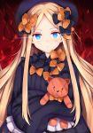  1girl abigail_williams_(fate/grand_order) bangs black_bow black_dress black_headwear blonde_hair blue_eyes blush bow closed_mouth commentary_request dress eyebrows_visible_through_hair fate/grand_order fate_(series) forehead hair_bow hat highres long_hair long_sleeves looking_at_viewer noose object_hug orange_bow parted_bangs pixcel polka_dot polka_dot_bow sleeves_past_fingers sleeves_past_wrists solo stuffed_animal stuffed_toy teddy_bear upper_body very_long_hair 
