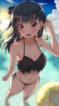  1girl :d arm_up bangs bare_arms bare_legs barefoot bikini black_bikini blue_eyes blunt_bangs blush breasts cleavage cloud collarbone dark_blue_hair eyebrows_visible_through_hair frilled_bikini_top from_above full_body hair_blowing hand_in_hair highres long_hair looking_at_viewer love_live! love_live!_sunshine!! lower_teeth navel open_mouth outdoors red_eyes side-tie_bikini side_bun small_breasts smile solo sunset swimsuit take-run-atelier tsushima_yoshiko water water_ring 