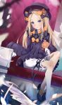  1girl abigail_williams_(fate/grand_order) absurdres armchair bangs black_bow black_dress black_footwear black_headwear blonde_hair bloomers blue_eyes blush bow bug butterfly chair closed_mouth commentary_request drawdream1025 dress fate/grand_order fate_(series) forehead hair_bow hat highres insect long_hair long_sleeves looking_at_viewer object_hug on_chair orange_bow parted_bangs polka_dot polka_dot_bow shoes sitting sleeves_past_fingers sleeves_past_wrists solo stuffed_animal stuffed_toy teddy_bear underwear very_long_hair white_bloomers 