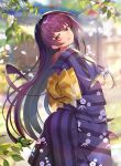  1girl alternate_costume architecture blurry blurry_background breasts cherry_blossoms commentary_request day east_asian_architecture fate/grand_order fate_(series) floral_print grass highres japanese_clothes kimono leaf long_hair looking_at_viewer looking_back nayuta_(una) obi outdoors paper purple_hair red_eyes sash scathach_(fate)_(all) scathach_(fate/grand_order) smile tree wide_sleeves 