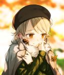  1girl autumn_leaves bangs beret black_headwear blonde_hair blurry blurry_background blush brown_eyes clothes_grab drill_hair fur_trim green_sweater hat highres idolmaster idolmaster_cinderella_girls jacket_on_shoulders leaf long_hair long_sleeves looking_at_viewer looking_away maple_leaf morikubo_nono okeno_kamoku ribbed_sweater ringlets self_hug smile solo sweater upper_body 