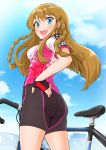  1girl :d ass bangs bicycle bike_jersey bike_shorts black_gloves black_shorts blue_eyes blue_sky braid breasts brown_hair cloud cowboy_shot day eyebrows_visible_through_hair fingerless_gloves from_below from_side gloves ground_vehicle hand_on_hip highres idolmaster idolmaster_million_live! kousaka_umi light_blush long_hair looking_at_viewer looking_to_the_side medium_breasts open_mouth outdoors short_sleeves shorts sidelocks sky skyline smile solo standing takuji_yuusaku twin_braids upper_teeth v-shaped_eyebrows 