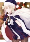  1girl artoria_pendragon_(all) black_choker blonde_hair blue_dress blue_gloves blue_headwear blush breasts cape carrying_bag carrying_over_shoulder choker christmas christmas_tree cowboy_shot dress fate/grand_order fate_(series) finger_to_mouth from_side fur-trimmed_cape fur-trimmed_dress fur-trimmed_hat fur_trim gloves hair_between_eyes highres indoors leaning_forward looking_at_viewer medium_breasts medium_hair meltymaple pantyhose platinum_blonde_hair pom_pom_(clothes) santa_alter shushing smile solo yellow_eyes 
