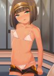  1girl absurdres bangs bare_arms bare_shoulders bikini black_shorts blush breasts brown_hair brown_hairband closed_mouth collarbone commentary_request dark_skin eyebrows_visible_through_hair green_eyes groin hairband highres indoors looking_at_viewer navel nose_blush open_clothes open_fly open_shorts original short_hair short_shorts shorts shorts_pull small_breasts solo strap_slip sweat swimsuit tongue tongue_out toy_box-r white_bikini 