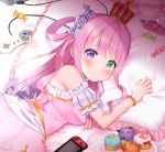  bed blush breasts candy commentary_request controller crown cupcake dress earrings food game_controller heterochromia himemori_luna hololive jewelry long_hair looking_at_viewer lying naomi_(fantasia) pillow pink_hair tray virtual_youtuber 