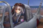  1girl aircraft aircraft_request alternate_costume aviator_cap bangs brown_eyes brown_gloves day eyebrows_visible_through_hair fur gloves goggles goggles_on_headwear hair_between_eyes haruto_(harut_n) hat highres jacket kantai_collection long_hair long_sleeves ocean outdoors salute shoukaku_(kantai_collection) sidelocks sky smile solo white_hair 