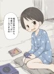  1girl :d bare_legs barefoot black_hair blue_pajamas blue_shirt blue_shorts blush brown_eyes buttons collarbone collared_shirt commentary_request controller fang game_console game_controller gamecube gamecube_controller highres ichigo_mashimaro indoors itou_chika kirby_(series) long_sleeves looking_at_viewer nanoningen_(anapoko) on_pillow open_mouth pajamas pillow print_pajamas shirt short_hair short_shorts shorts sitting skin_fang smile solo translation_request wariza 