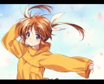  1girl bangs blue_sky blurry closed_mouth cloud cloudy_sky commentary day eyebrows_visible_through_hair hair_ribbon hand_on_own_head highres kuroi_mimei letterboxed light_blush light_particles long_sleeves looking_at_viewer lyrical_nanoha orange_shirt outdoors petals ribbon shirt short_hair sky sleeves_past_wrists smile solo takamachi_nanoha twintails upper_body white_ribbon wind 
