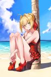  1girl ahoge bangs bare_shoulders beach blonde_hair blue_sky blush braid breasts cleavage closed_mouth collarbone dress dress_swimsuit fate/grand_order fate_(series) french_braid green_eyes hair_bun hair_intakes hair_ribbon high_heels highres knees_up large_breasts legs long_hair looking_at_viewer nero_claudius_(fate)_(all) nero_claudius_(swimsuit_caster)_(fate) ocean palm_tree red_dress red_footwear red_ribbon ribbon sitting sky smile solo tanako_(645316096) tree 