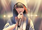  1girl alternate_costume bang_dream! black_hair collarbone earrings hair_between_eyes hair_over_one_eye hood hoodie hoop_earrings jewelry microphone mitake_ran multicolored_hair music open_mouth poligon_(046) red_eyes red_hair ring singing solo stage_lights strap streaked_hair two-tone_hair 