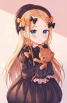  1girl abigail_williams_(fate/grand_order) absurdres backlighting bangs black_bow black_dress black_headwear blonde_hair blue_eyes blush bow breasts commentary dress fate/grand_order fate_(series) forehead hair_bow hat highres holding holding_stuffed_animal huge_filesize long_hair long_sleeves looking_at_viewer monjja multiple_bows multiple_hair_bows orange_bow parted_bangs parted_lips ribbed_dress sleeves_past_fingers sleeves_past_wrists small_breasts solo stuffed_animal stuffed_toy teddy_bear 