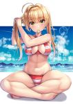  1girl absurdres ahoge beeyan bikini blonde_hair blue_sky blurry blush bokeh breasts cleavage criss-cross_halter day depth_of_field earrings eyebrows_visible_through_hair fate/grand_order fate_(series) green_eyes hair_intakes hair_tie_in_mouth halterneck highres holding holding_hair jewelry large_breasts long_hair looking_at_viewer mouth_hold navel nero_claudius_(fate)_(all) nero_claudius_(swimsuit_caster)_(fate) ocean outdoors outside_border shiny shiny_skin side-tie_bikini sitting sky smile solo sparkle stomach striped striped_bikini swimsuit twintails tying_hair 