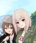  2020 2girls bangs beret birthday black_jacket blue_eyes blue_sky blush brown_eyes brown_hair casual character_name cloud cloudy_sky commentary day eyebrows_visible_through_hair girls_und_panzer green_jacket grey_headwear grey_shirt half-closed_eyes hat highres itsumi_erika jacket long_sleeves looking_at_viewer medium_hair multiple_girls nasunael nishizumi_maho open_mouth outdoors pointing print_shirt self_shot shirt short_hair side-by-side silver_hair sky smile translated white_shirt 