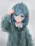  1girl alternate_costume bangs blue_eyes blue_hair blue_jacket commentary_request eyebrows_visible_through_hair grey_background hair_between_eyes hair_bobbles hair_ornament hand_up highres hood hooded_jacket jacket kawashiro_nitori long_sleeves looking_up no_hat no_headwear rain raincoat short_hair simple_background solo torinari_(dtvisu) touhou upper_body wet wet_hair 