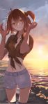  1girl ahoge akira_(akira_arika_d) backlighting bangs beach breasts closed_mouth fate/grand_order fate_(series) fujimaru_ritsuka_(female) hair_ornament hair_scrunchie hawaiian_shirt highres looking_at_viewer medium_breasts navel ocean one_side_up orange_eyes orange_hair orange_sky scrunchie shirt shorts sky smile solo sunset thighs tied_shirt tropical_summer wading white_shorts 