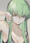  bangs beige_background black_tank_top breasts c.c. cleavage code_geass collarbone creayus english_commentary green_hair hand_on_own_cheek long_hair looking_to_the_side sweat tank_top yellow_eyes 