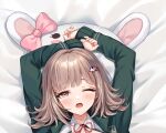  1girl 71150521_(user_agrk2888) bed_sheet blunt_bangs blush bow brown_hair collared_shirt d; danganronpa_(series) danganronpa_2:_goodbye_despair ear_bow galaga green_jacket hair_ornament highres jacket long_sleeves medium_hair nanami_chiaki neck_ribbon one_eye_closed pink_bow pink_eyes pink_ribbon ribbon shirt solo tears two-tone_shirt white_shirt 