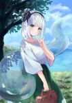  1girl adapted_costume bag cloud cloudy_sky contemporary green_eyes green_skirt highres holding holding_bag konpaku_youmu konpaku_youmu_(ghost) long_skirt looking_at_viewer narutakaya shirt short_hair skirt sky smile solo touhou tree white_hair white_shirt 