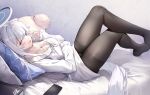  1girl absurdres bed_sheet blue_archive breasts cellphone cleavage grey_hair halo highres large_breasts long_hair long_sleeves looking_at_viewer lubikaya mechanical_halo noa_(blue_archive) open_mouth pajamas phone pillow purple_eyes smartphone smile solo white_pajamas 