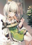  1girl animal_ear_fluff animal_ears arknights arm_support bare_legs bare_shoulders black_choker blurry blurry_background breasts choker cleavage depth_of_field dress green_dress green_eyes hand_up jacket kal&#039;tsit_(arknights) kinty looking_at_viewer medium_breasts medium_hair off_shoulder open_clothes open_jacket ore_lesion_(arknights) parted_lips plant silver_hair sitting sleeveless sleeveless_dress solo spaghetti_strap stethoscope syringe watch white_jacket wristwatch 