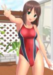  1girl absurdres alice_gear_aegis breasts brown_hair cleavage collarbone commentary_request competition_swimsuit contrapposto cowboy_shot dark_skin fence green_eyes highres kaneshiya_sitara looking_at_viewer medium_breasts one-piece_swimsuit plant red_swimsuit sliding_doors smile solo standing swimsuit takafumi v 