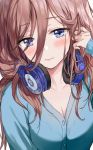  1girl blue_cardigan blue_eyes blush breasts brown_hair buttons cardigan cleavage closed_mouth commentary_request eyebrows_visible_through_hair go-toubun_no_hanayome hair_between_eyes headphones headphones_around_neck highres korean_commentary long_hair looking_at_viewer nakano_miku saya_(mychristian2) solo upper_body 