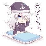  1girl anchor_symbol black_headwear blue_eyes blush buttons drooling eyebrows_visible_through_hair futon hair_between_eyes hamayuu_(litore) hat hibiki_(kantai_collection) highres kantai_collection long_hair long_sleeves nightcap one_eye_closed open_mouth pajamas pillow pom_pom_(clothes) silver_hair simple_background solo white_background 