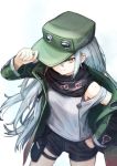  1girl absurdres black_shorts coat cowboy_shot cross from_above g11_(girls_frontline) girls_frontline green_coat green_headwear grey_eyes hand_in_pocket hat_tug highres long_hair mari0ball off_shoulder open_clothes open_coat scarf shirt shorts silver_hair simple_background solo sweatdrop thigh_pouch thigh_strap very_long_hair white_background white_shirt 