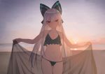  1girl absurdres backlighting beach bikini bow breasts cowboy_shot dusk girls_frontline hair_bow halterneck highres horizon juz long_hair looking_at_viewer navel outdoors outstretched_arms sarong sarong_removed sidelocks silver_hair sky small_breasts smile solo swimsuit tokarev_(girls_frontline) twitter_username very_long_hair 