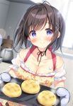  1girl apron bangs black_hair blurry blurry_background blush bread breasts cleavage closed_mouth commentary_request depth_of_field eyebrows_visible_through_hair floral_print food hair_ornament indoors medium_breasts melon_bread original oven_mitts pan_(mimi) print_apron puffy_short_sleeves puffy_sleeves purple_eyes short_sleeves smile solo standing white_sleeves x_hair_ornament yellow_apron 